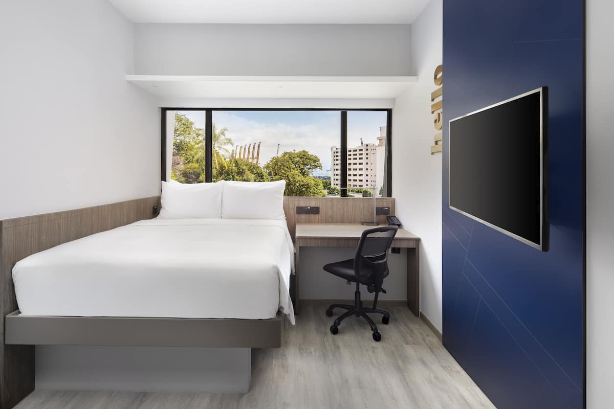 Deluxe Room, 1 Queen Bed | 1 bedroom, in-room safe, individually decorated, individually furnished
