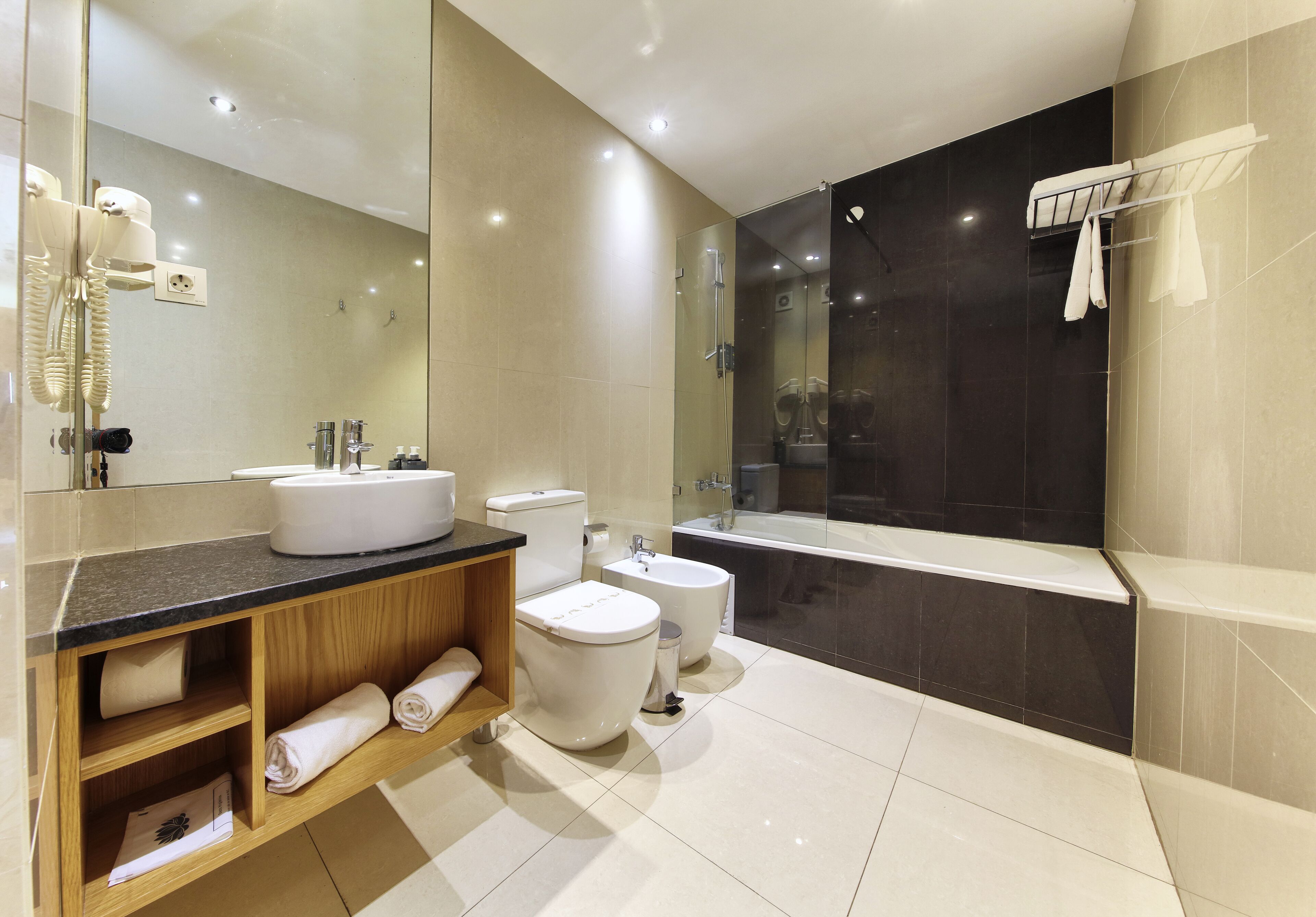 designer toiletries, hair dryer, towels, soap