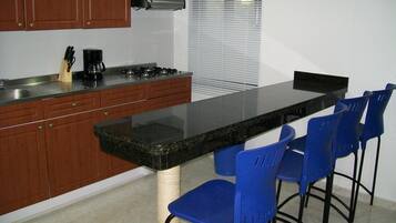 Studio Suite | Private kitchen | Full-sized fridge, microwave, stovetop, espresso maker