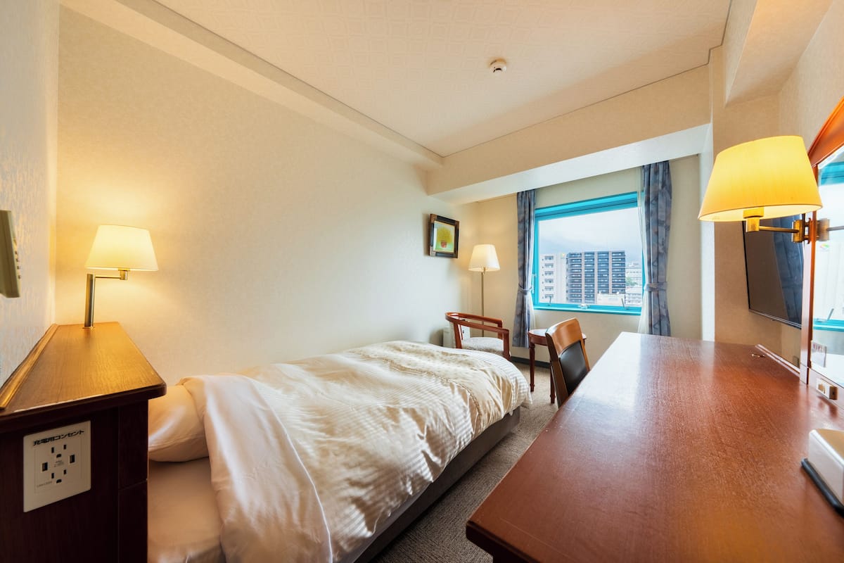 Desk, laptop workspace, free WiFi, bed sheets