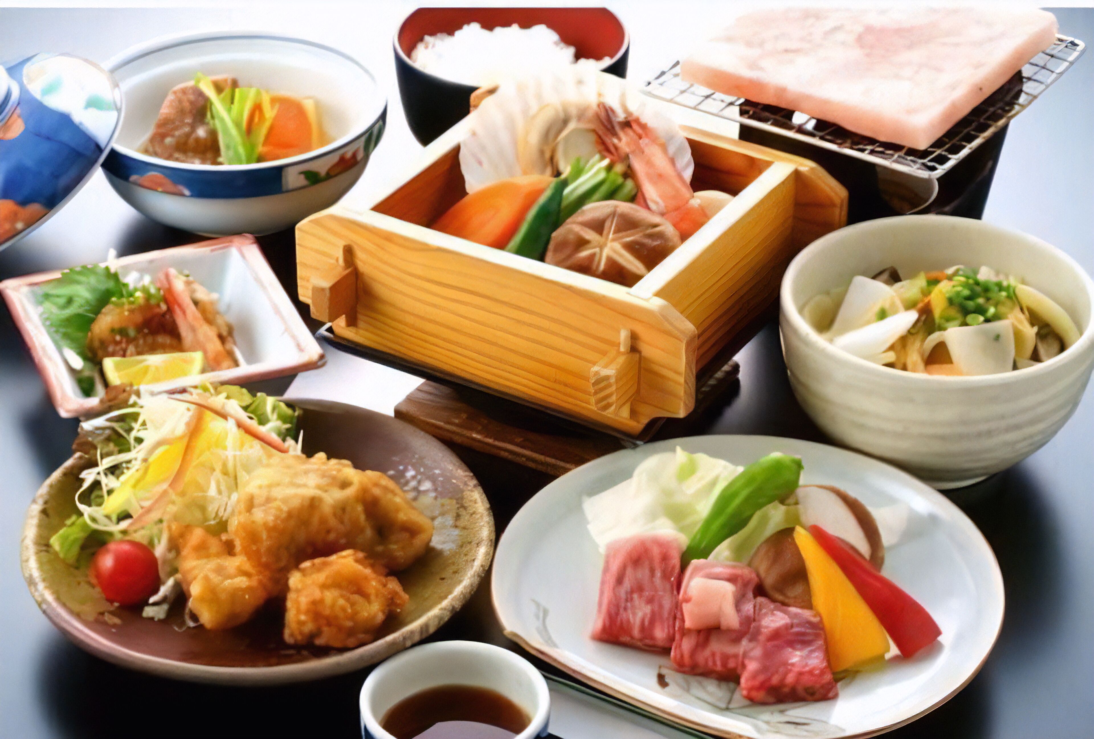 A variety of Japanese dishes including sushi, sashimi, and tempura.