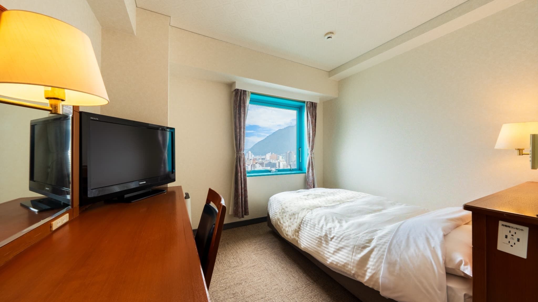 Desk, laptop workspace, free WiFi, bed sheets