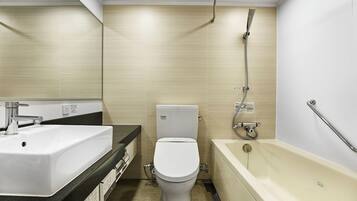 Combined shower/tub, free toiletries, hair dryer, slippers