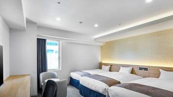 Standard Triple Room, Smoking | Down comforters, blackout drapes, iron/ironing board, bed sheets