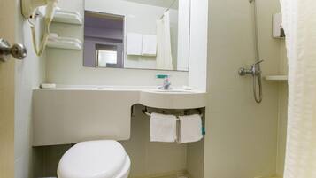 Combined shower/tub, free toiletries, hair dryer, slippers