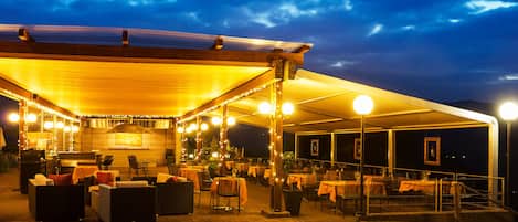 Breakfast, lunch, dinner served; Mediterranean cuisine, garden views