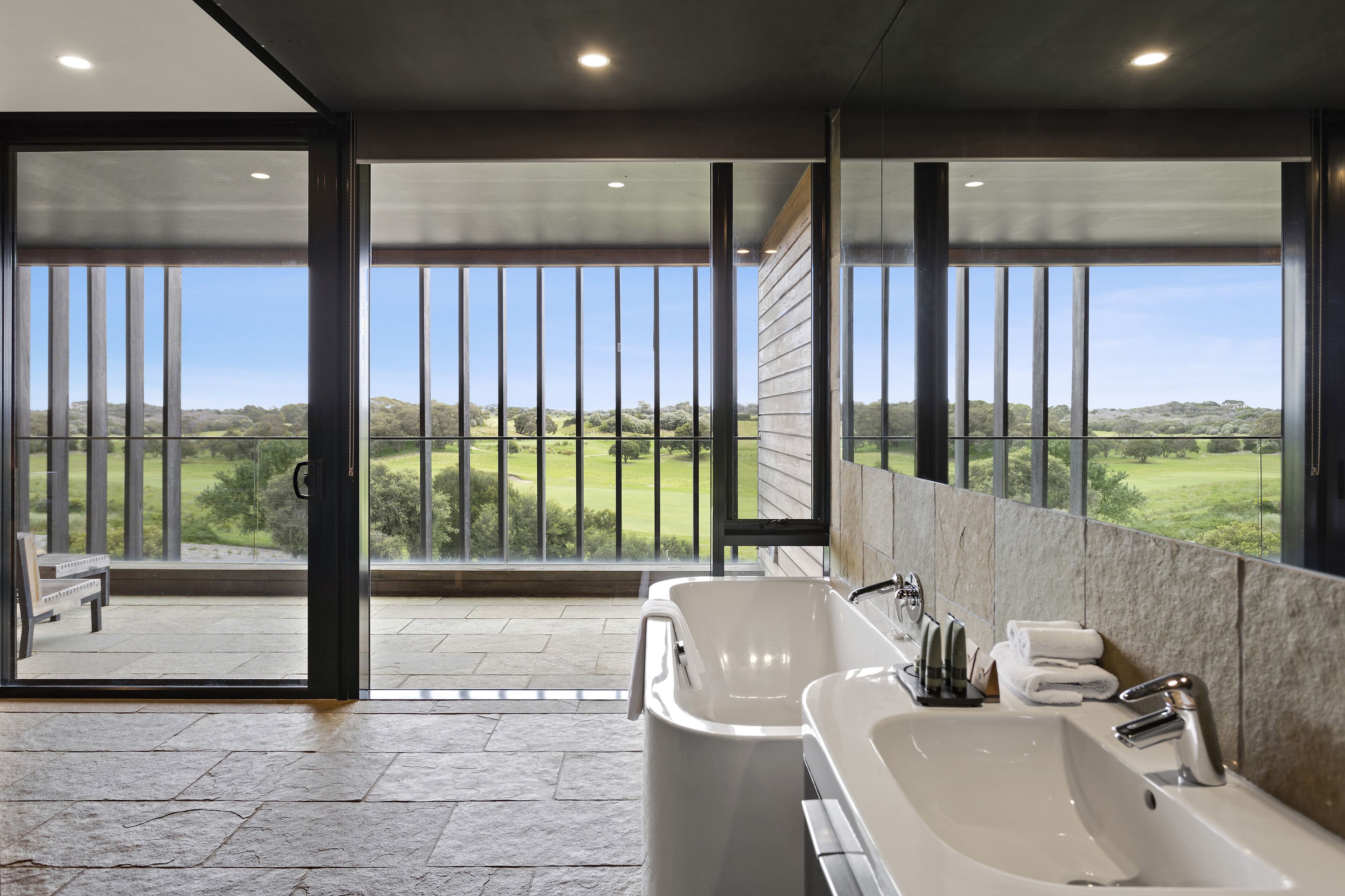 designer toiletries, hair dryer, towels