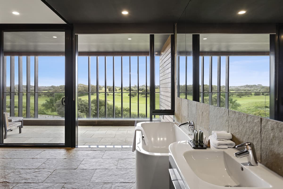 designer toiletries, hair dryer, towels