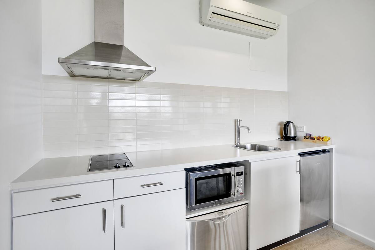 one bedroom suite | private kitchen | fridge, electric kettle, cookware/dishes/utensils