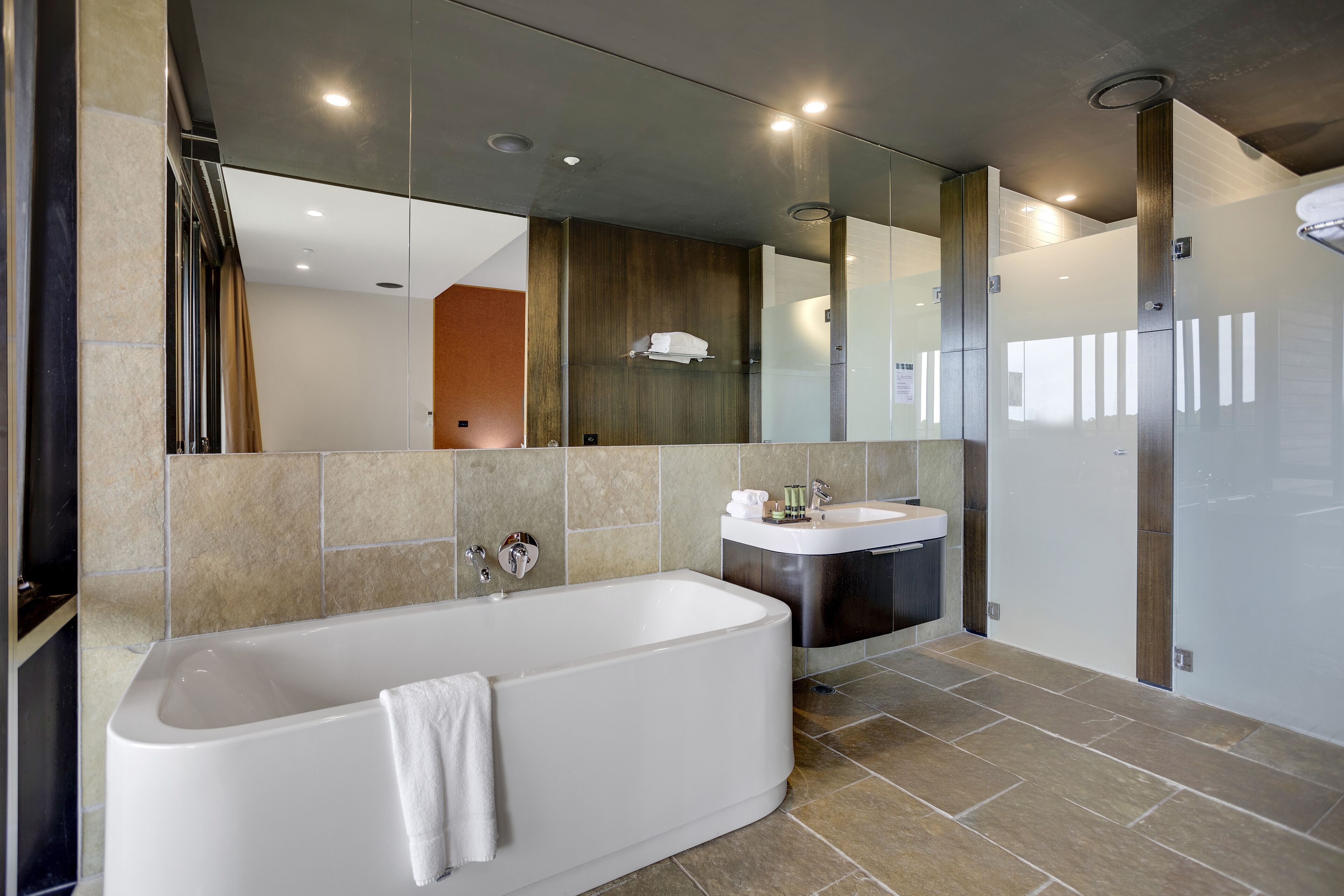 designer toiletries, hair dryer, towels