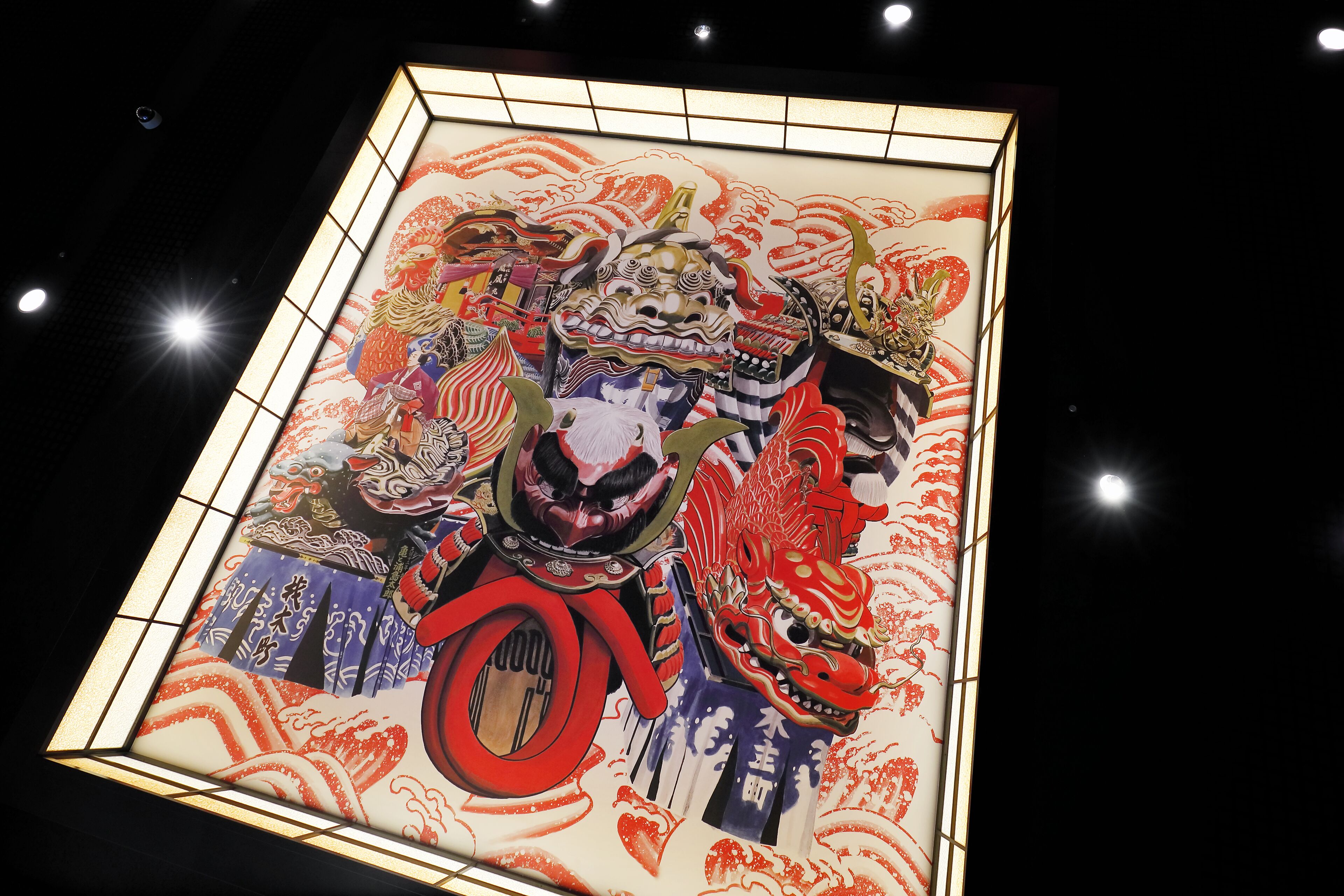 A traditional Japanese artwork with a lion dance figure, framed by a grid pattern.