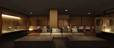 A modern interior with a sectional sofa, multiple seating areas, and ambient lighting.