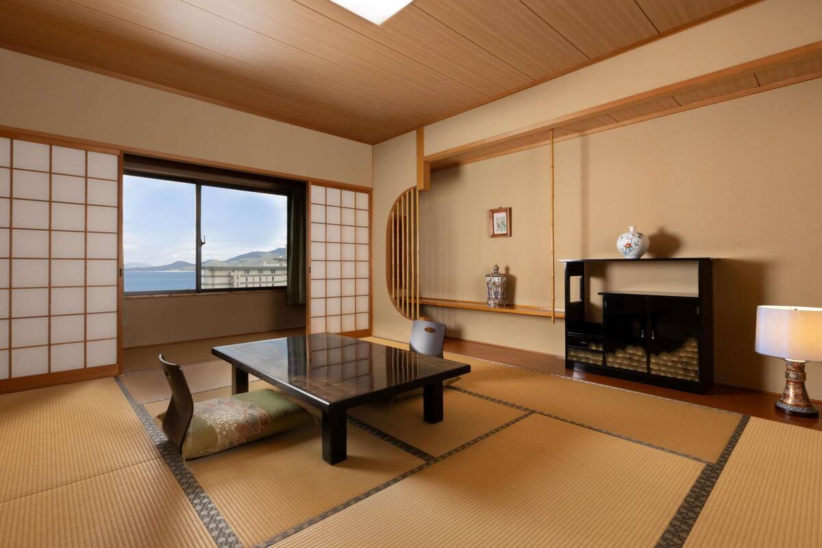 Deluxe Suite, Multiple Beds, Sea View | Down comforters, in-room safe, desk, free WiFi