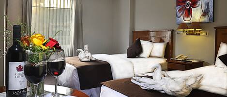 Premium bedding, down comforters, pillowtop beds, in-room safe
