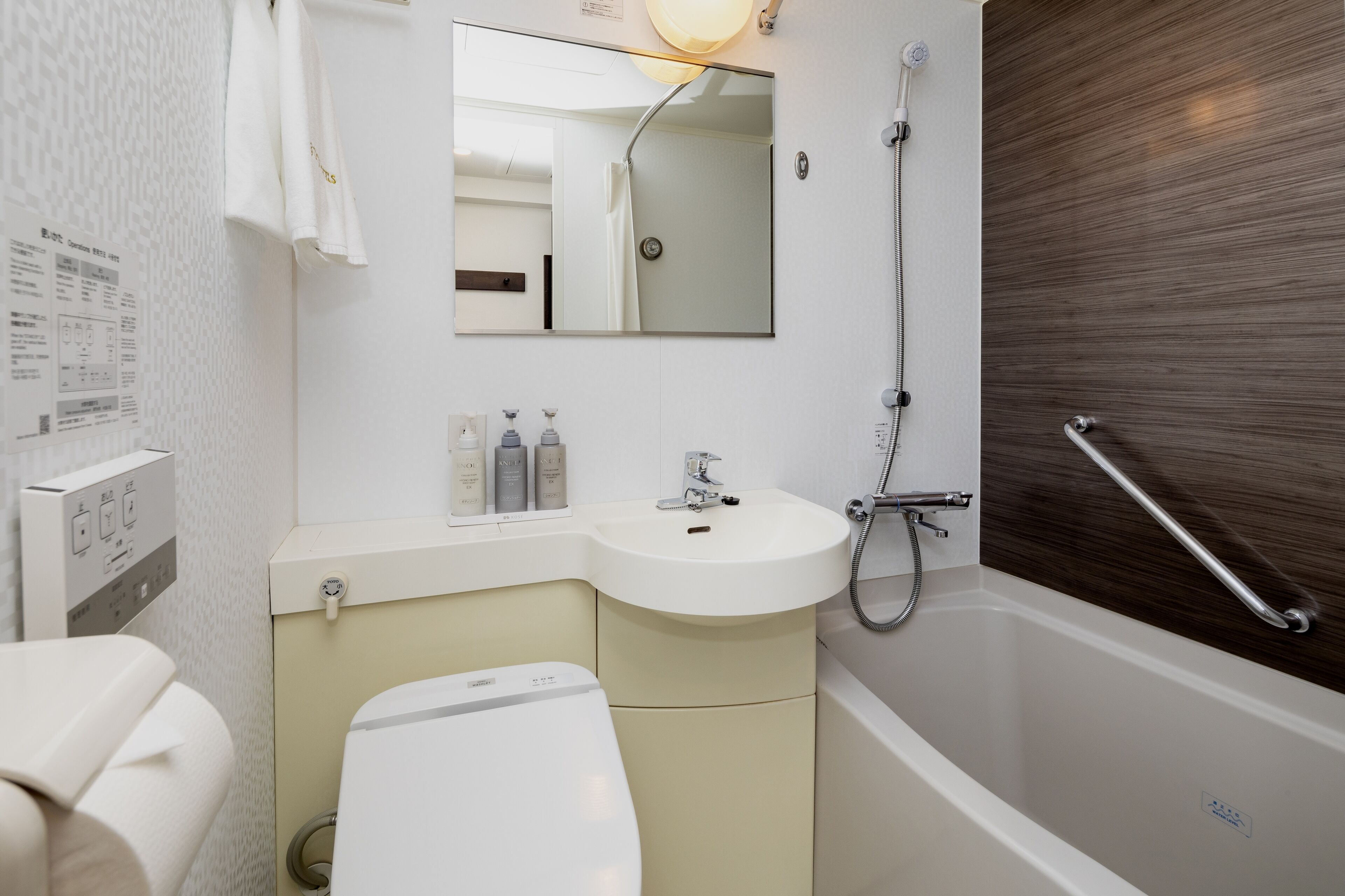 combined shower/bathtub, free toiletries, hair dryer, slippers