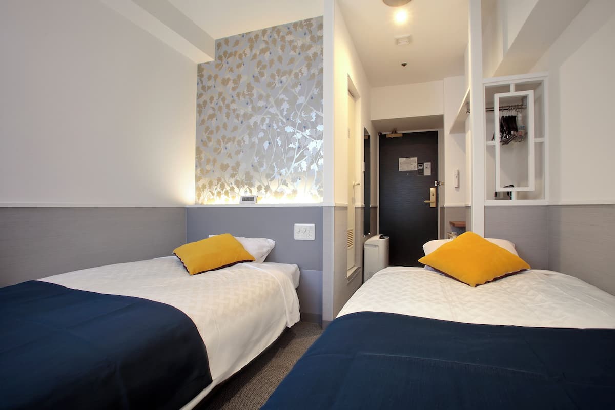 Premium bedding, laptop workspace, blackout curtains, soundproofing