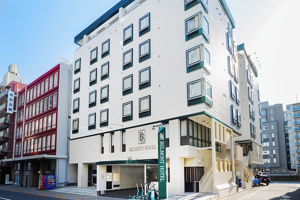 A multi-story hotel with a prominent 'BELMONT HOTEL' sign, a covered entrance, and a staircase leading to the entrance. - Tokyo Asakusabashi Belmont Hotel (Tokyo)