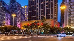 A high-rise hotel with the name "PRESIDENT" prominently displayed on the facade. - Hotel Presidente Macau (Macau)