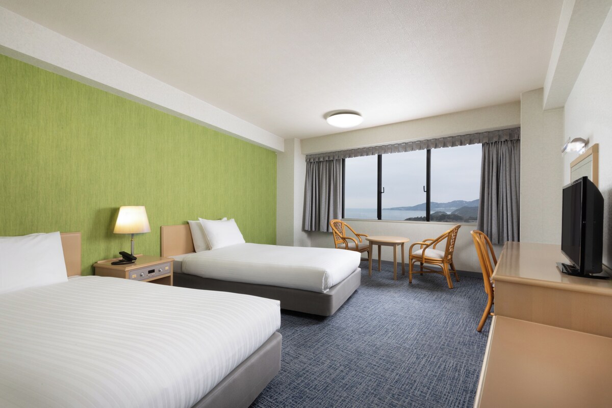 Classic Room with 2 single and 1 sofa and 2 futon beds, Ocean/Sea view | In-room safe, desk, laptop workspace, blackout drapes