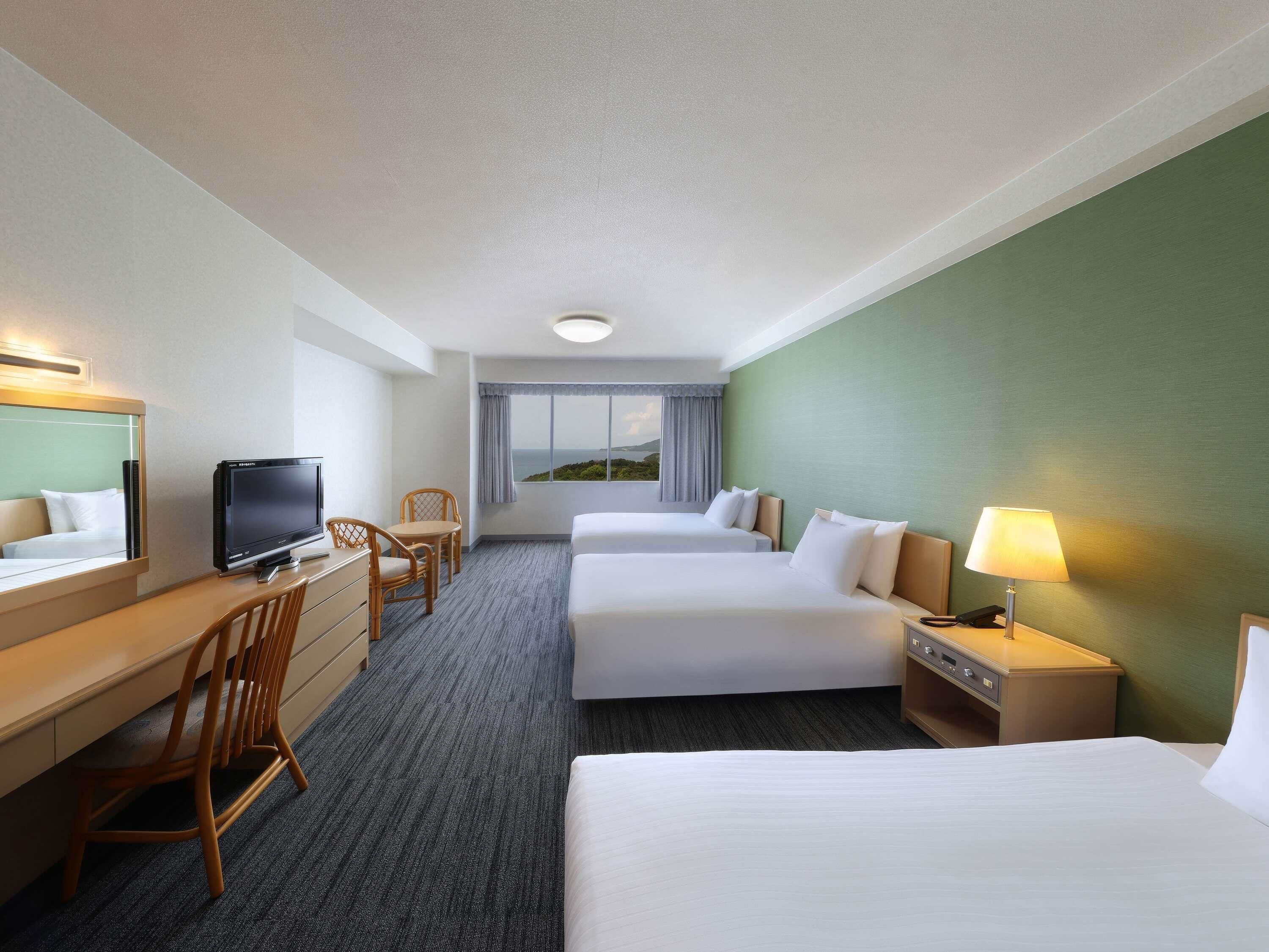 Standard Triple Room | In-room safe, desk, laptop workspace, blackout curtains
