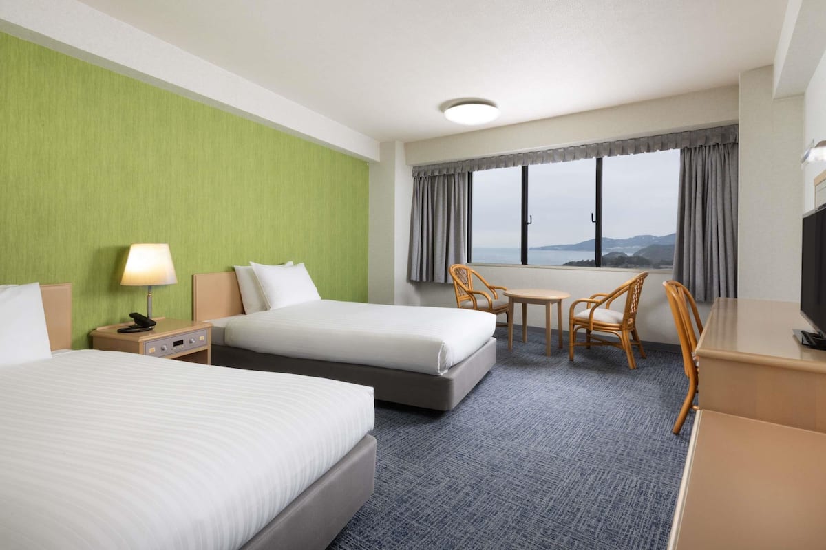 Classic Room with 2 single and 1 sofa and 2 futon beds, Ocean/Sea view | In-room safe, desk, laptop workspace, blackout drapes