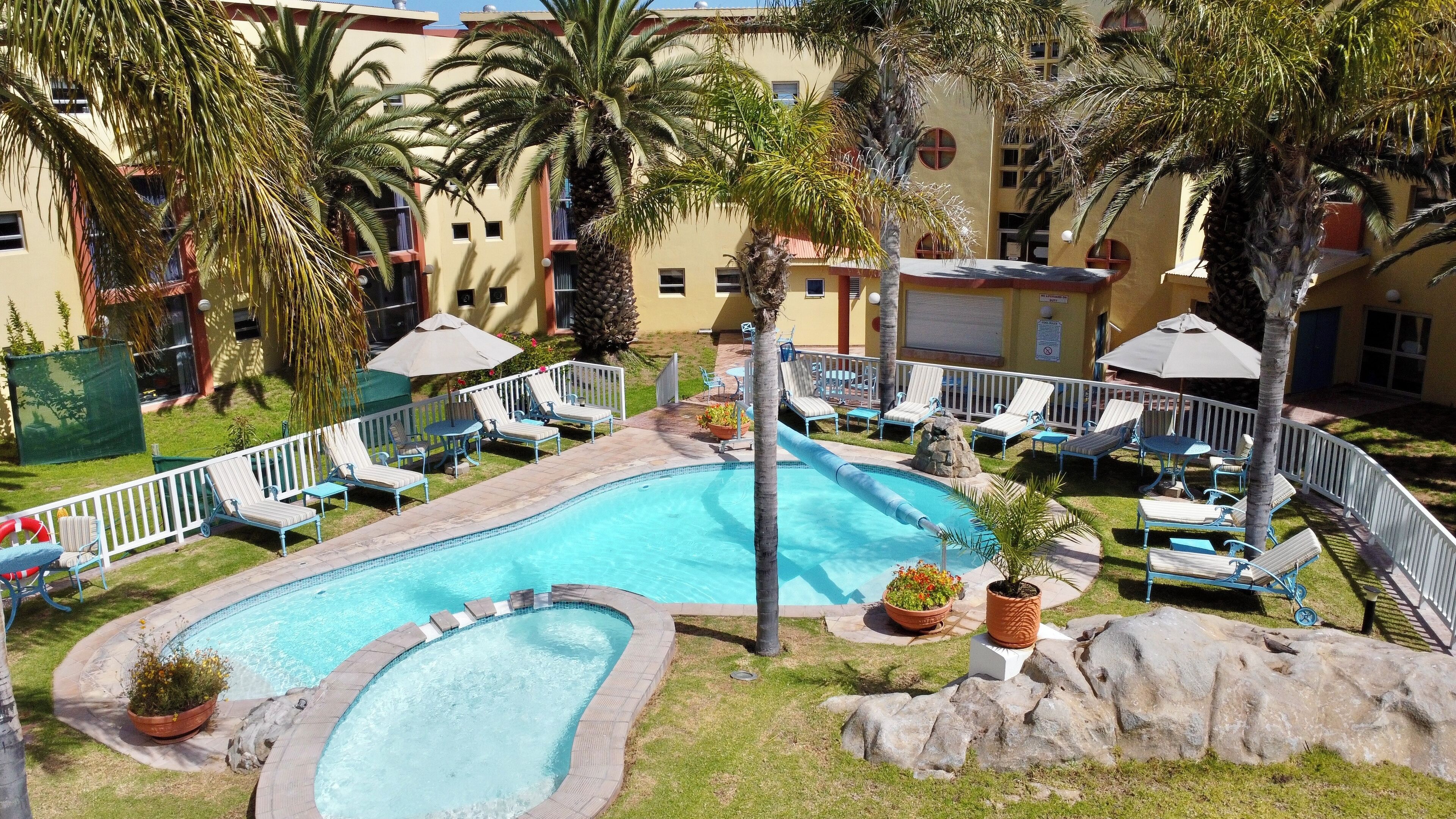 Outdoor pool, free cabanas, pool umbrellas