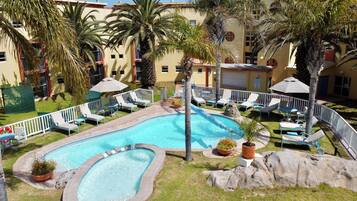 Outdoor pool, free cabanas, pool umbrellas