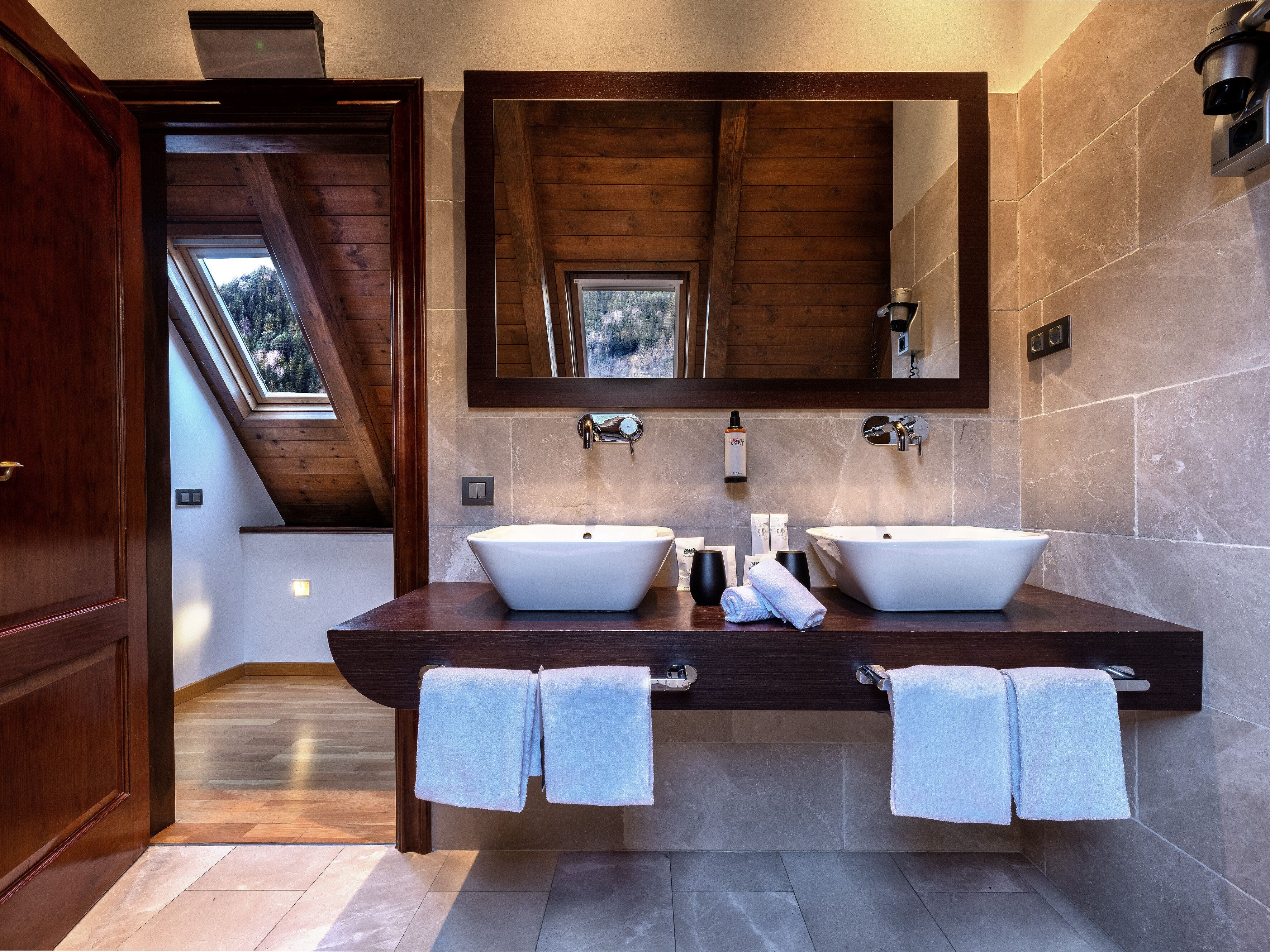 designer toiletries, hair dryer, bidet, towels