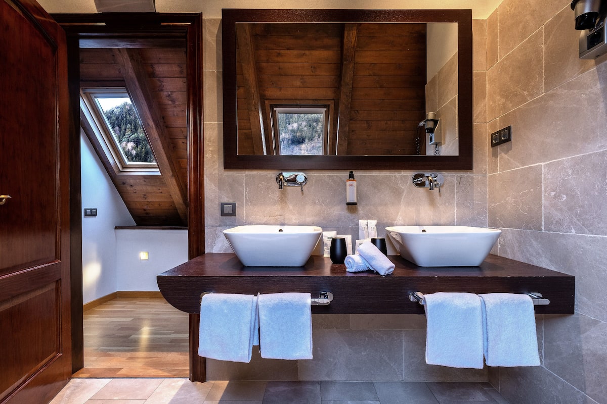 designer toiletries, hair dryer, bidet, towels