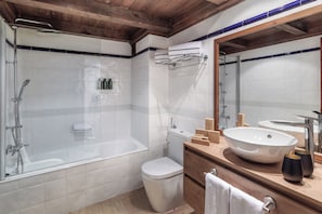 Designer toiletries, hair dryer, bidet, towels