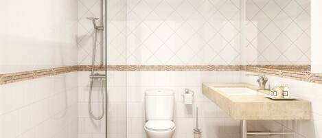 Un baño moderno con cabina de ducha de vidrio, inodoro y lavamanos con encimera color beige.