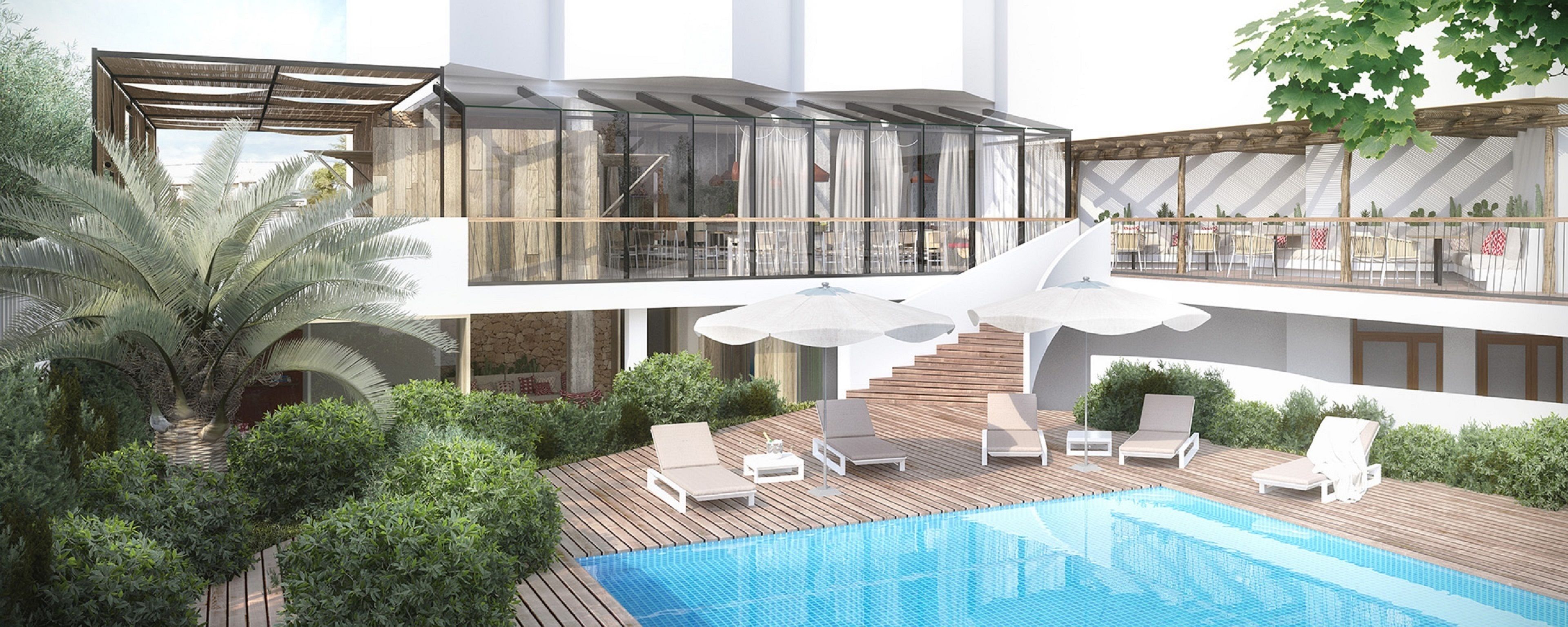 A modern outdoor pool area with lounge chairs, a wooden deck, and a glass-enclosed upper level with a dining area.