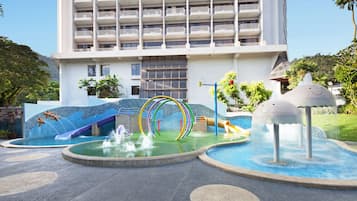 Kids can play and splash in the adjacent water park with a slide, pool, and play structures.
