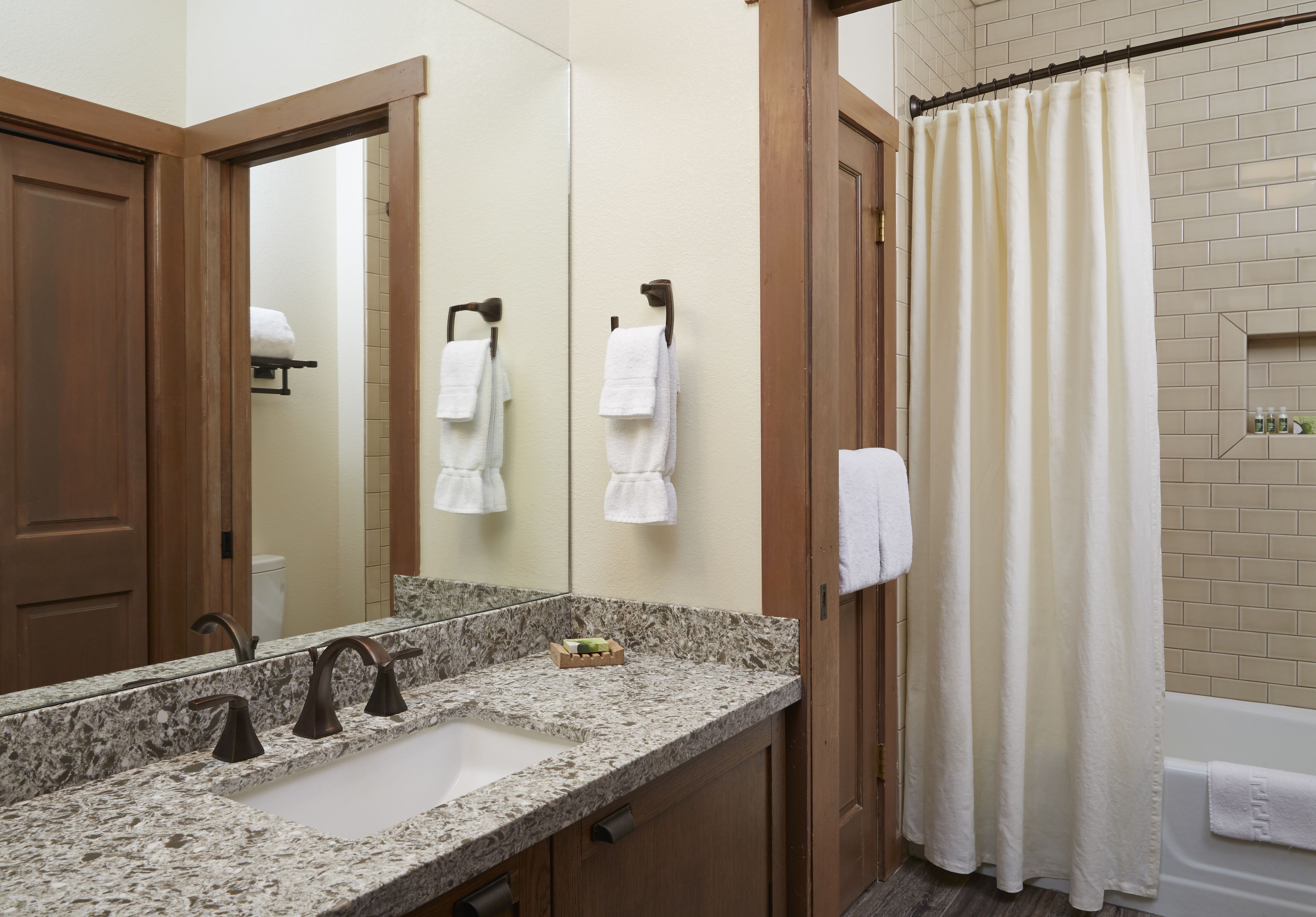 designer toiletries, hair dryer, towels, soap