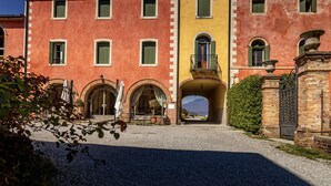 A building with multiple windows and a central archway.