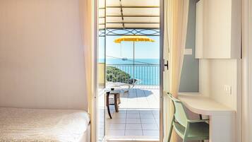 Panoramic Triple Room, Sea View | Minibar, in-room safe, desk, free WiFi