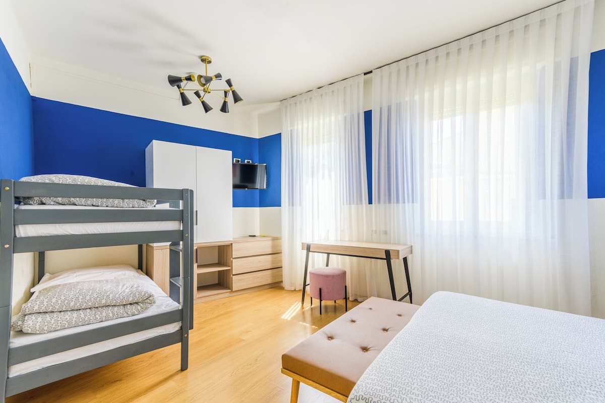 Economy Quadruple Room | Minibar, in-room safe, desk, free WiFi