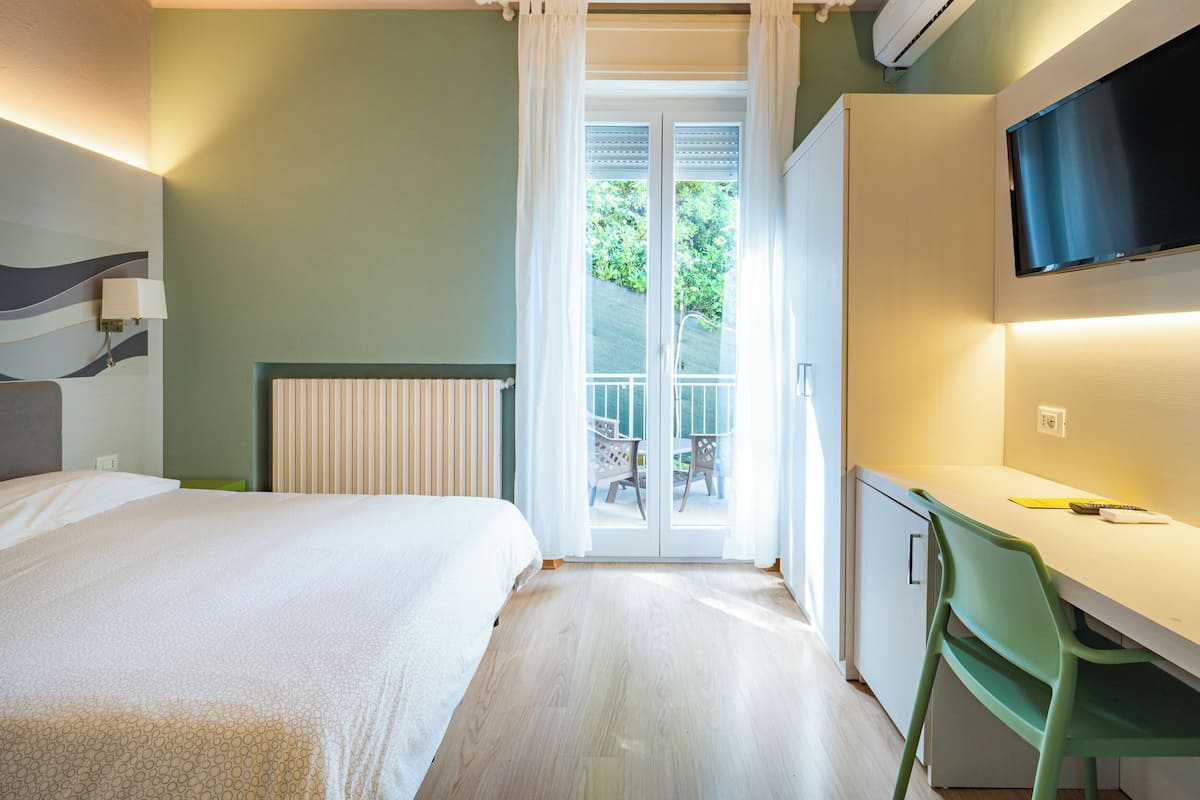 Standard Triple Room, Balcony | Minibar, in-room safe, desk, free WiFi