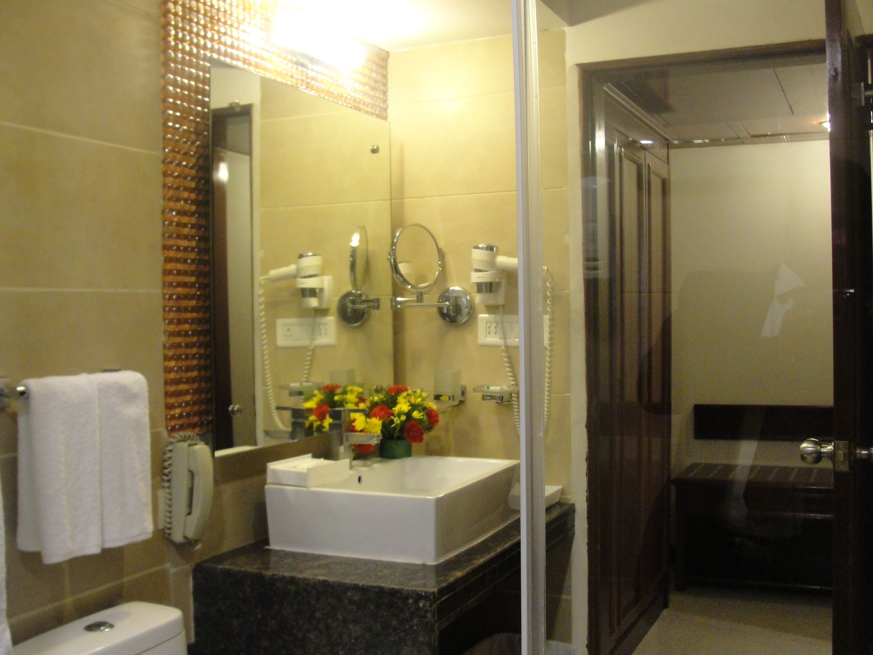 combined shower/bathtub, designer toiletries, hair dryer, bathrobes