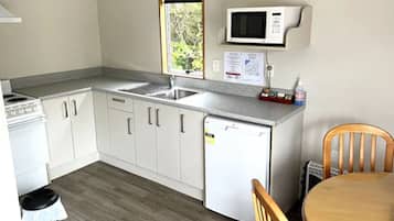 Apartment, 1 Bedroom | Private kitchen | Fridge, coffee/tea maker, electric kettle, cookware/dishes/utensils