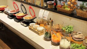 A buffet with various food items and condiments. - Hotel Resol Trinity Sapporo (Sapporo)