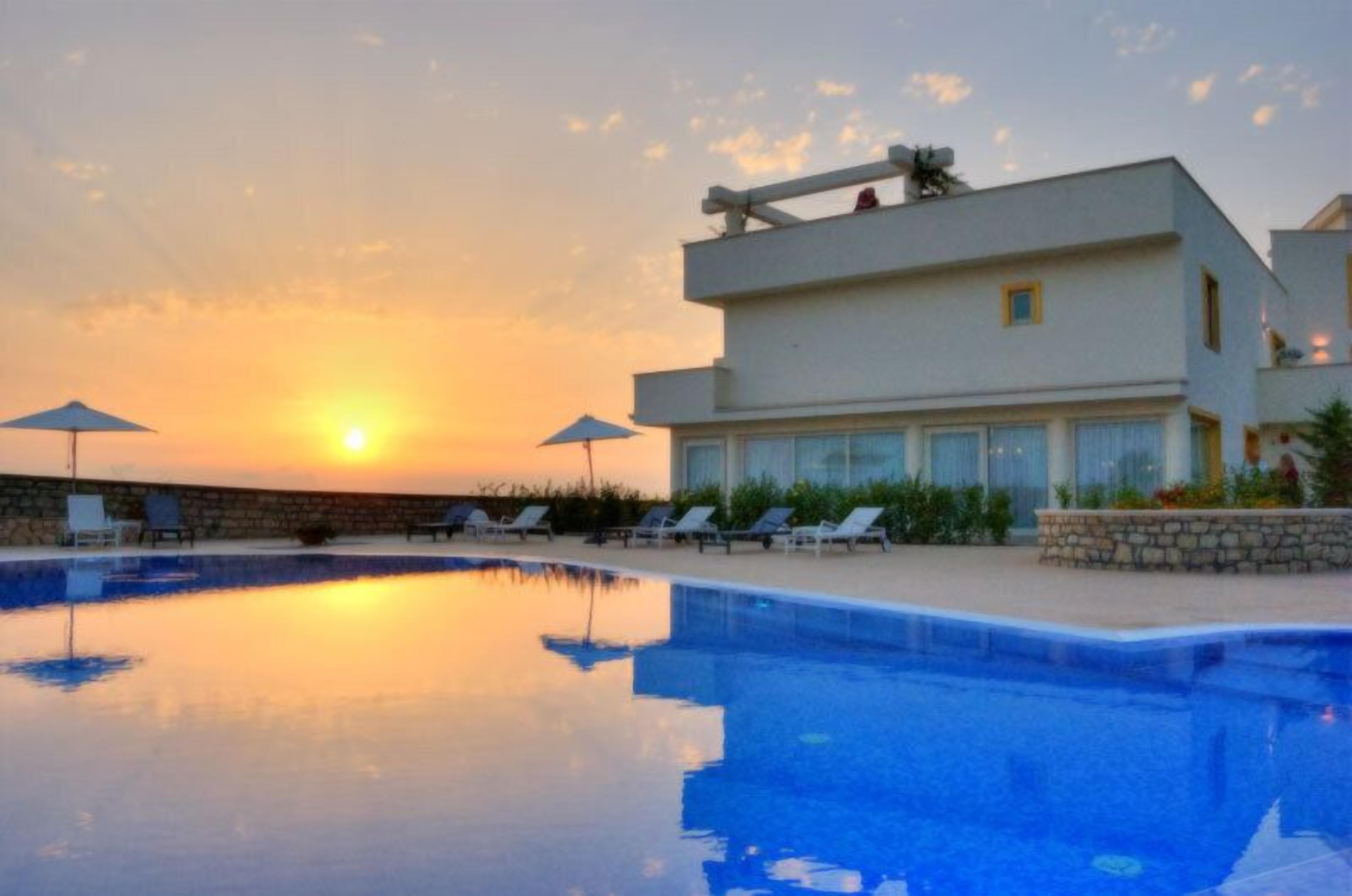 Seasonal outdoor pool, open 10:00 AM to 7:30 PM, pool umbrellas