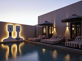 Outdoor pool, open 10 AM to 7 PM, pool loungers