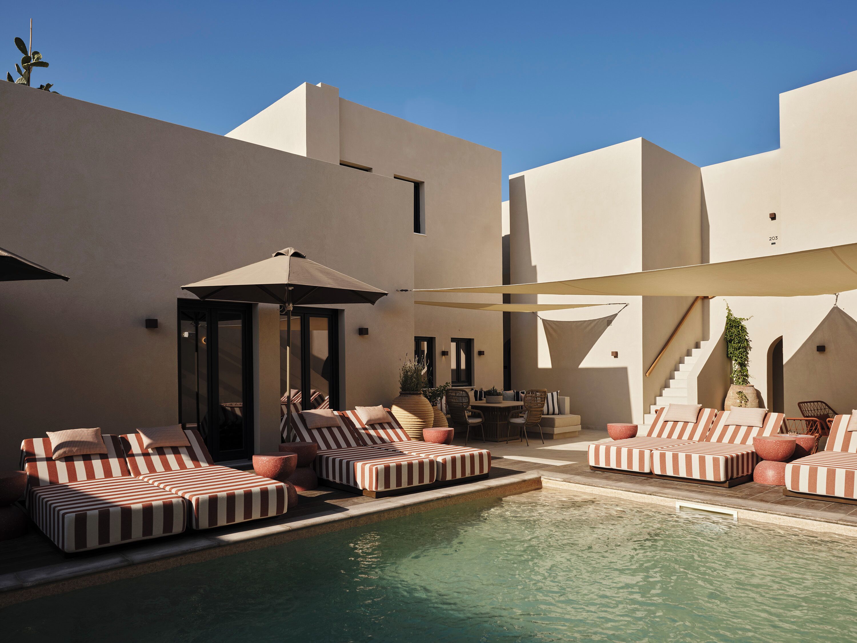 Outdoor pool, open 10 AM to 7 PM, pool loungers