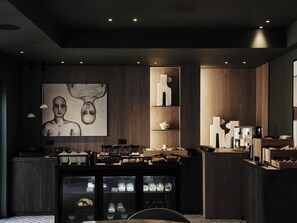 A modern kitchen with dark wood cabinetry, a central island with a built-in refrigerator, and a large abstract painting on the wall. - NAUMA PAROS Design Boutique Hotel-Adults Only (Paros)