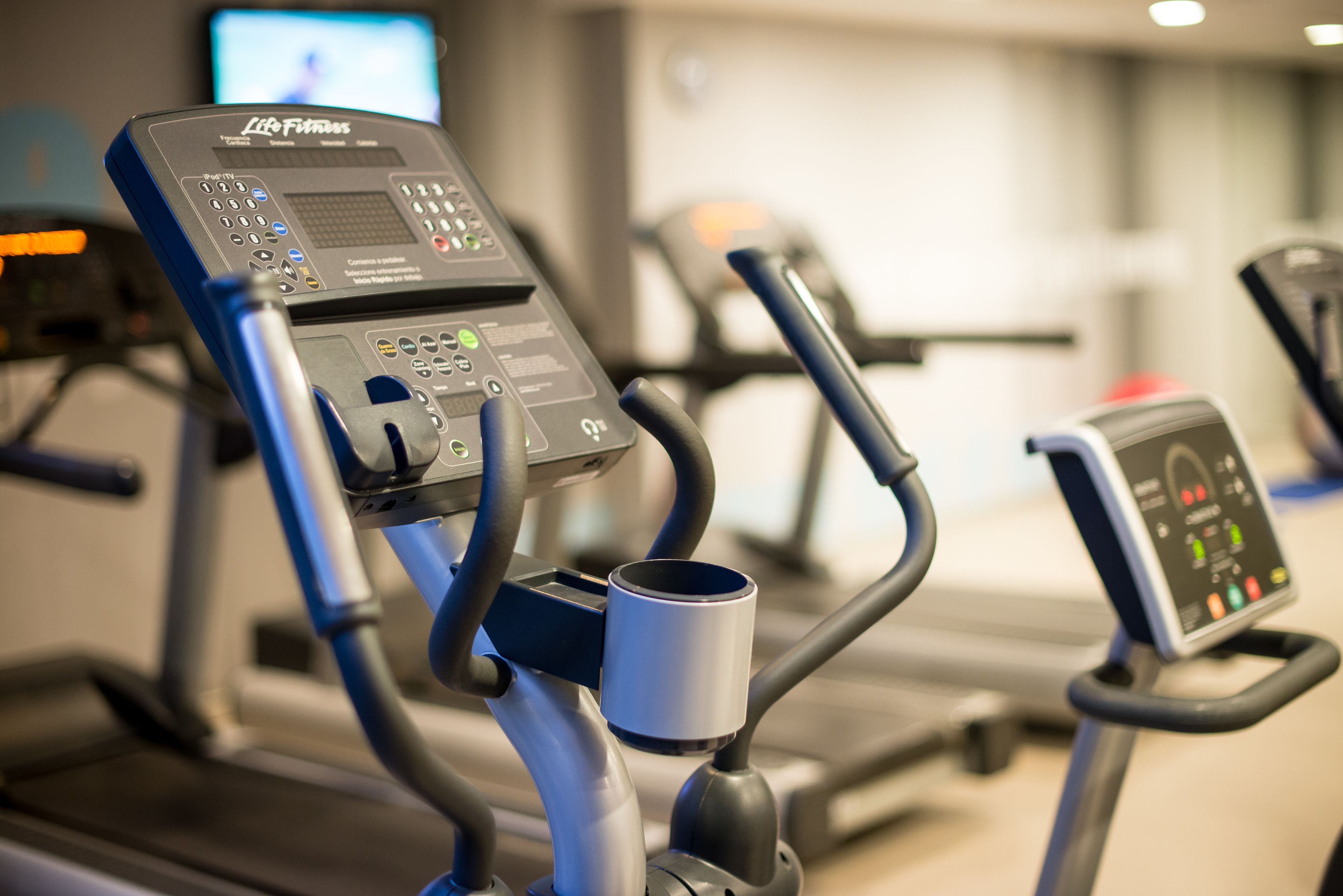 A gym with treadmills and exercise equipment.