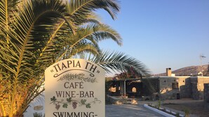 A sign for 'TAPIA TH' café, wine-bar, and swimming-pool. - Swiss Home (Paros)