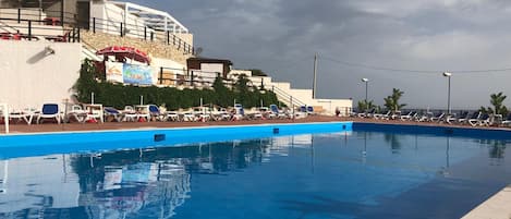 Outdoor pool, open 9:00 AM to 7:00 PM, pool umbrellas, sun loungers