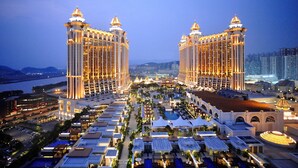 A large hotel complex with multiple towers, a central courtyard, and a pool area. - Galaxy Hotel (Cotai)