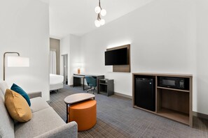 Suite, 1 King Bed, Accessible, Non Smoking (Roll In Shower) | In-room safe, desk, laptop workspace, iron/ironing board